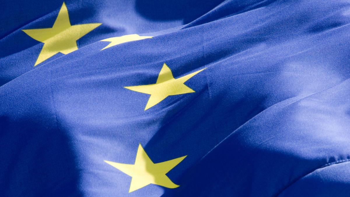 There is an EU flag in the picture.